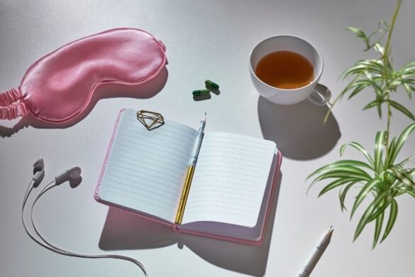 Ancient Beauty Secrets self-care routine with tea and journal setup