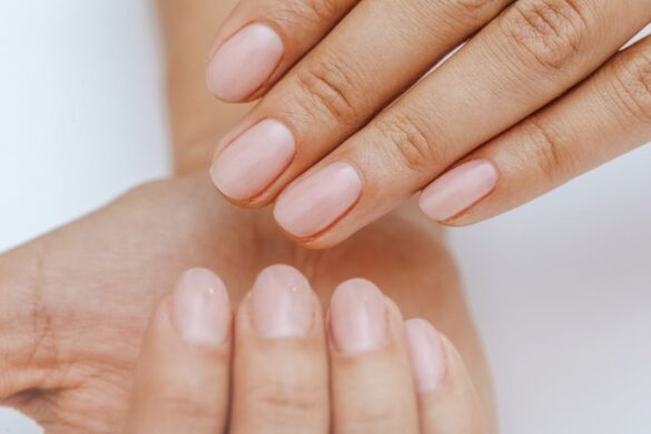 Hands displaying the finished results of a perfect manicure at home technique