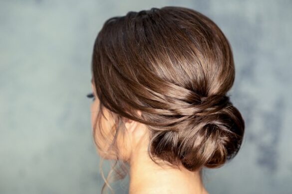 Elegant low bun protective hairstyle for damaged hair recovery